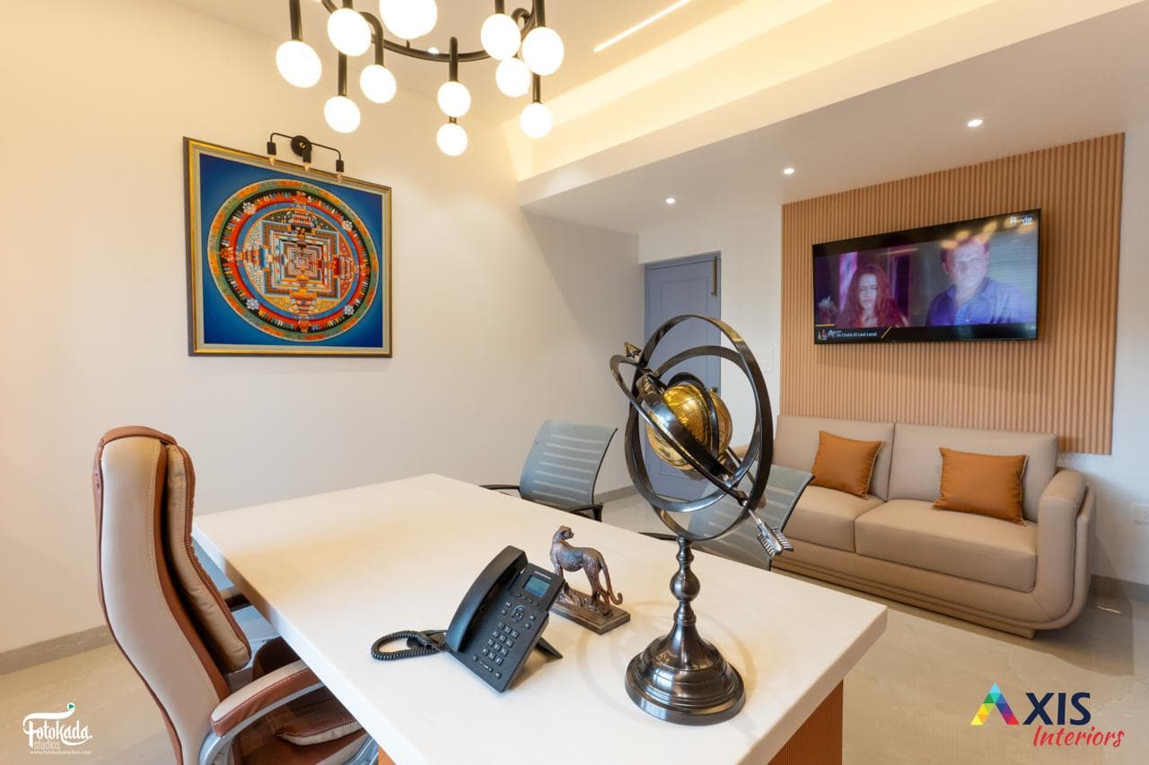 Consultation lounge with armillary sphere and mandala artwork